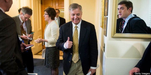 UNITED STATES - FEBRUARY 28: Sen. Lindsey Graham, R-S.C., center, arrives for the bipartisan press conference to discuss the introduction of a resolution supporting Israel as Sen. Susan Collins, R-Maine, speaks with a reporter on Thursday, Feb. 28, 2013. (Photo By Bill Clark/CQ Roll Call)