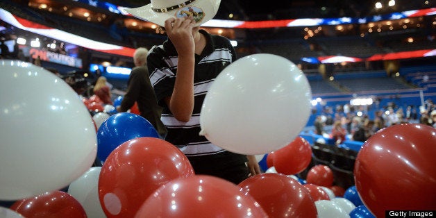 A boy wears a cowboy hat at the Republican National Convention (RNC) in Tampa, Florida, U.S., on Thursday, Aug. 30, 2012. Republican presidential nominee Mitt Romney, a wealthy former business executive who served as Massachusetts governor and as a bishop in the Mormon church, is under pressure to show undecided voters more personality and emotion in his convention speech tonight, even as fiscal conservatives in his own party say he must more clearly define his plans for reining in the deficit and improving the economy. Photographer: Daniel Acker/Bloomberg via Getty Images