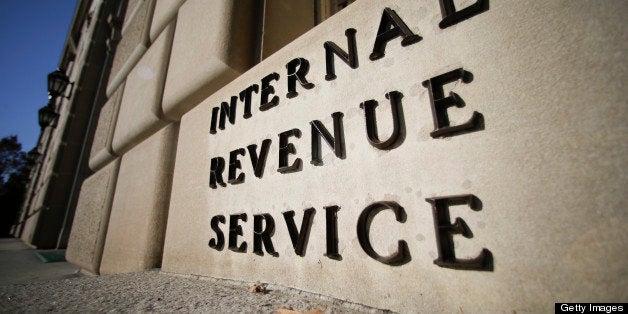 The Internal Revenue Service (IRS) building stands in Washington, D.C., U.S., on Tuesday, Nov. 13, 2012. President Barack Obama expressed confidence that he and Congress would reach an agreement that will avoid the automatic spending cuts and tax increases that are scheduled to occur at the end of the year. The fiscal cliff is the $607 billion combination of automatic spending cuts and tax increases scheduled to take effect in January. Lawmakers are trying to avert the cliff to prevent a short-term shock to the economy and reach an agreement on long-term deficit reduction. Photographer: Andrew Harrer/Bloomberg via Getty Images