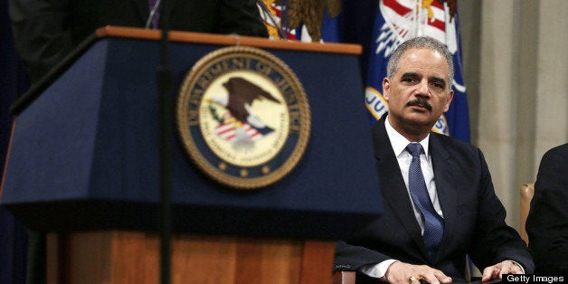 WASHINGTON, DC - MAY 01: U.S. Attorney General Eric Holder waits to be introduced during a Justice Department?s Law Day event May 1, 2013 at the Justice Department in Washington, DC. Law Day was observed at the Justice Department to celebrate the legal system and the freedoms Americans enjoy. (Photo by Alex Wong/Getty Images)