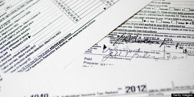 Copies of the U.S. Department of the Treasury Internal Revenue Service (IRS) 1040 Individual Income Tax form for the 2012 tax year belonging to U.S. Vice President Joseph Biden and his wife, Jill Biden, is arranged for a photograph in Washington, D.C., U.S., on Friday, April 12, 2013. In 2012, Vice President Joseph Biden and his wife, Jill, had $385,072 in adjusted gross income and paid $87,851 in federal taxes for a 22.8 percent rate, tax returns released today showed. Photographer: Andrew Harrer/Bloomberg via Getty Images