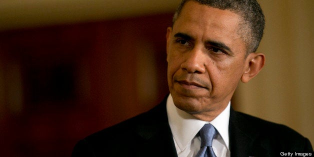 U.S. President Barack Obama listens during a news conference with David Cameron, U.K. prime minister, not pictured, in the Ea
