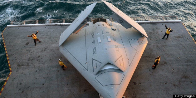 ATLANTIC OCEAN - MAY 14: In this handout released by the U.S. Navy, Sailors move an X-47B Unmanned Combat Air System (UCAS)