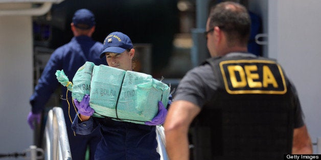 MIAMI, FL - APRIL 26: Crewmembers from the Coast Guard Cutter Bernard C. Webber offload some of the 2,200 pounds of cocaine, seized during Operation Martillo, worth an estimated $27 million on April 26, 2013 in Miami, Florida. The cocaine was found while the crew was conducting a law enforcement patrol, where they located a 68-foot fishing vessel in the western Caribbean Sea, April 18, 2013. The crew of the Cutter Gallatin boarded the vessel, located 2,200 pounds of cocaine, and detained three suspected smugglers. (Photo by Joe Raedle/Getty Images)