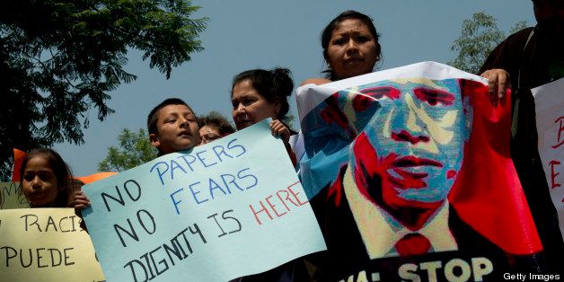 Mexican children born in the United States and deported to Mexico take part in a protest organized by the Meso-American Migrant Movement to demand the deportation of Mexicans from the US to stop, on May 2, 2013 in front of the US embassy in Mexico City. Migration will be among the top issues when US President Barack Obama visits Mexico and Costa Rica this week, and many in the region hope Washington will finally act to give 11 million undocumented workers a path to citizenship. Obama headed to Mexico on Thursday to put trade back at the heart of bilateral ties, but his southern neighbour's shifting drug war tactics loom large over the visit. AFP PHOTO / Yuri CORTEZ (Photo credit should read YURI CORTEZ/AFP/Getty Images)