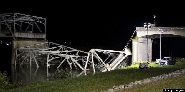 MT. VERNON, WASHINGTON - MAY 23: The scene of a bridge collapse int the Skagit River on Interstate 5 is pictured May 23, 2013 near Mt. Vernon, Washington. People and cars were thrown into the river when the four-lane bridge collapsed. At least three people were rescued from the water but there have been no reported deaths. Police are investigating witnesses reports that a semi-truck may have struck the bridge causing the collapse. (Stephen Brashear/Getty Images)