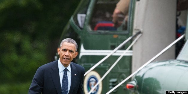 US President Barack Obama walks to the Oval Office after disembarking from Marine One at the White House in Washington on May 24, 2013 upon his return from giving the commencement address at the Naval Academy in Annapolis, Maryland. AFP PHOTO/Nicholas KAMM (Photo credit should read NICHOLAS KAMM/AFP/Getty Images)