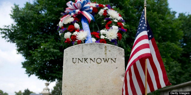 UNITED STATES - MAY 25: Members of Rolling Thunder placed a wreath on the grave of an unknown solider, who died during the Civil War era, at Congressional cemetery. The group will hold a variety of events this Memorial Day weekend in the Washington area to honor veterans of past wars. (Photo by Chris Maddaloni/CQ Roll Call)