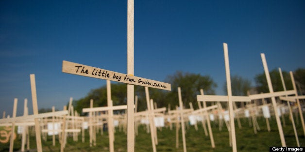 Hundreds of crosses, representing gun deaths since the Newtown, Connecticut elementary shootings, are placed on the National Mall on April 11, 2013 in Washington, DC. Two US senators have reached a compromise that would expand background checks for gun sales, an official said, in what could result in the most ambitious change to gun laws since 1994. The deal comes four months after the Connecticut shootings that took the epidemic of gun violence in the United States to an alarming new level. AFP PHOTO / Karen BLEIER (Photo credit should read KAREN BLEIER/AFP/Getty Images)