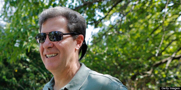 Kansas governor Sam Brownback, right, listens to Marc Murrell, middle, of the Kansas Deptartment of Wildlife, Parks and Tourism while on a walking tour of the Great Plains Nature Center in Wichita, Kansas, on Wednesday, September 19, 2012. Brownback announced at the center on Wednesday the formation of the Kansas Ecotourism Steering Committee to help guide ecotourism efforts in the state. (Travis Heying/Wichita Eagle/MCT via Getty Images)