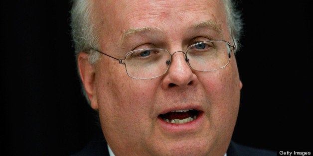 DALLAS, TX - APRIL 12: Karl Rove, former Deputy Chief of Staff and Senior Policy Advisor to U.S. President George W. Bush, prepares to lead a panel discussion at The 4% Project Conference on April 12, 2011 at Southern Methodist University in Dallas, Texas. The economic conference, sponsored by the George W. Bush Presidential Center, intends to increase awareness of public policies and private business strategies that increase opportunity and prosperity for Americans. (Photo by Tom Pennington/Getty Images)