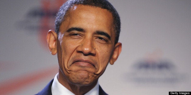 US President Barack Obama, speaking of receiving injections, frowns while addressing the American Nurses Association House of