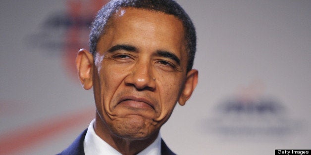 US President Barack Obama, speaking of receiving injections, frowns while addressing the American Nurses Association House of Delegates June 16, 2010 at a hotel in Washington, DC. AFP PHOTO/Mandel NGAN (Photo credit should read MANDEL NGAN/AFP/Getty Images)