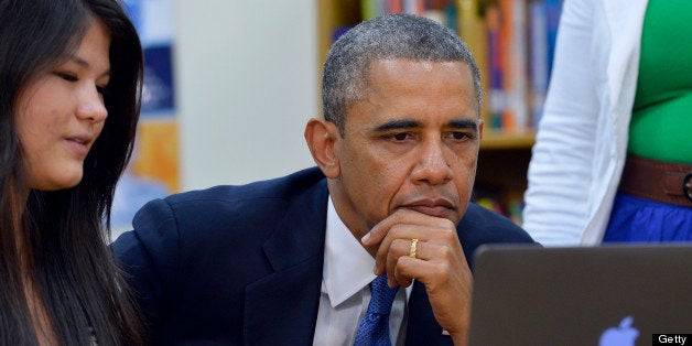 US President Barack Obama listens to student as he tours Mooresville Middle School in Mooresville, North Carolina, on June 6, 2013. Obama arrived in North Carolina as part of his Middle Class Jobs & Opportunity Tour. AFP PHOTO/Jewel Samad (Photo credit should read JEWEL SAMAD/AFP/Getty Images)