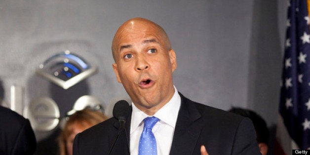 NEWARK, NJ - JUNE 8: Former U.S. Senator Bill Bradley, left, listens as Newark Mayor Cory Booker speaks during a news confere