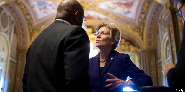 UNITED STATES - FEBRUARY 12: Sen. Elizabeth Warren, D-Mass., talks with Sen. William 'Mo' Cowan, D-Mass., in the Senate Reception Room before the senate luncheons in the Capitol. (Photo By Tom Williams/CQ Roll Call)
