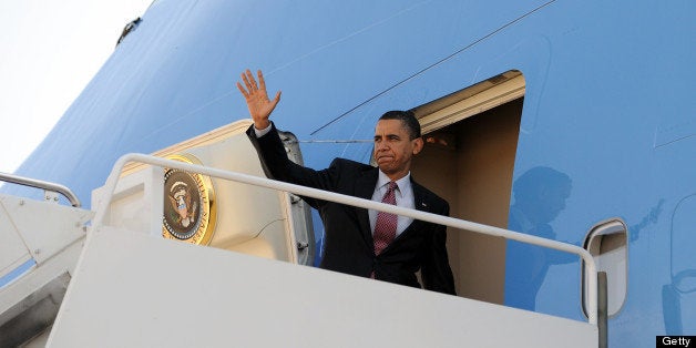US President Barack Obama boards Air Force One at the Andrews Air Force base in Maryland on April 2, 2010 to travel to Charlo