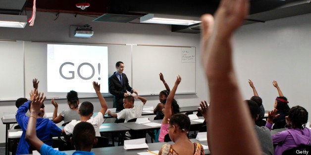 WASHINGTON, DC - AUGUST 13:Math teacher Robert Biemesderfer asks students questions during the opening of a BASIS charter school, a brand that has been called one of the most challenging high schools in the country at a boot camp type program where students will begin to learn all of the behaviors that are expected of them at the school, as well as continue to catch up academically so that they can start the ultra-rigorous regular curriculum the following week in Washington, DC on Monday August 13, 2012. (Photo by Jabin Botsford/For The Washington Post via Getty Images)