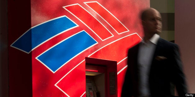 A man walks past a Bank of America Corp. automated teller machine (ATM) in Charlotte, North Carolina, U.S., on Wednesday, May 8, 2013. Bank of America Corp. needs to show a steady stream of profit before satisfying demands for a higher dividend, Chief Executive Officer Brian T. Moynihan said during the annual shareholders meeting today. Photographer: Davis Turner/Bloomberg via Getty Images