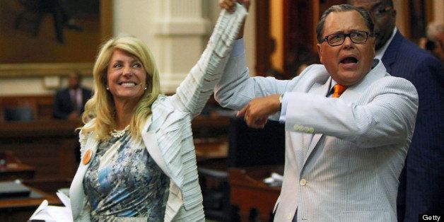AUSTIN, TX - JUNE 25: State Sen. Jose Rodriguez (D-El Paso) (R) celebrates with State Sen. Wendy Davis (D-Ft. Worth) (3L) as the Democrats defeat the anti-abortion bill SB5, which was up for a vote on the last day of the legislative special session June 25, 2013 in Austin, Texas. A combination of Sen. Davis' 13-hour filibuster and protests by reproductive rights advocates helped to ultimately defeat the controversial abortion legislation at midnight. (Photo by Erich Schlegel/Getty Images)