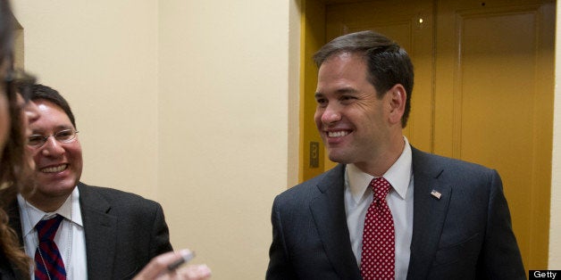 UNITED STATES - May 7 : Sen. Marco Rubio, R-Fl., talks with reporters about immigration reform on his way to the luncheons in the U.S. Capitol on May 7, 2013. (Photo By Douglas Graham/CQ Roll Call)