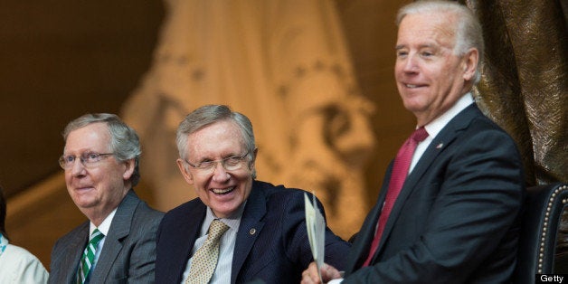 WASHINGTON, DC - JUNE 19: (L-R) Senate Minority Leader Mitch McConnell (R-KY), Senate Majority Leader Harry Reid (D-NV) and U.S. Vice President Joe Biden laugh during a dedication ceremony for the new Frederick Douglass Statue in Emancipation Hall in the Capitol Visitor Center, at the U.S. Capitol, on June 19, 2013 in Washington, DC. The 7 foot bronze statue of Douglass joins fellow black Americans Rosa Parks, Martin Luther King Jr. and Sojourner Truth on permanent display in the Capitol's Emancipation Hall. (Photo by Drew Angerer/Getty Images)