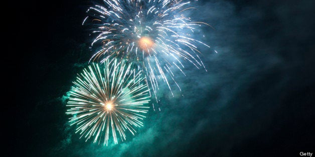 Gorgeous green, blue and purple fireworks against a cloud of smoke that looks like the Milky Way. The sort of thing you would see at New Year's, July 4th or other public holidays.