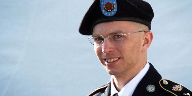 FORT MEADE, MD - JUNE 06: U.S. Army Private Bradley Manning is escorted as he leaves a military court at the end of the first of a three-day motion hearing June 6, 2012 in Fort Meade, Maryland. Manning, an Army intelligence analyst who has been accused of passing thousands of diplomatic cables and intelligence reports to the whistleblowing website WikiLeaks and facing 22 charges including aiding the enemy, returned to the court room to ask for dismissal of 10 of the charges. (Photo by Alex Wong/Getty Images)