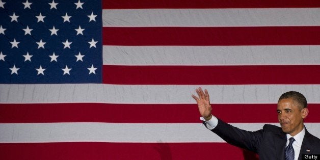 US President Barack Obama waves after speaking during a Democratic fundraiser in Chicago, Illinois, May 29, 2013. AFP PHOTO /