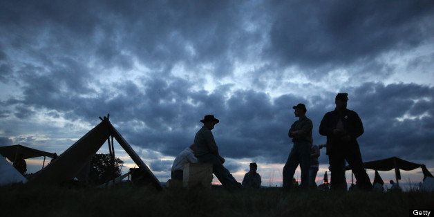 GETTYSBURG, PA - JULY 01: Union Civil War re-enactors await nightfall while camped at the Gettysburg National Military Park on the 150th anniversary of the historic battle on July 1, 2013 in Gettysburg, Pennsylvania. The Union victory, which took place July 1-3, 1863, is widely considered the turning point in the American Civil War. Union and Confederate armies suffered a combined total of up to 51,000 casualties over three days, the highest number of any battle in the four-year war. (Photo by John Moore/Getty Images)