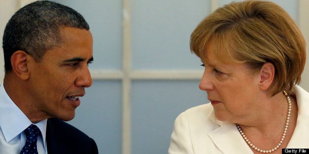 US President Barack Obama (L) and German Chancellor Angela Merkel chat during during a dinner at the Charlottenburg palace in Berlin,on June 19, 2013. Obama said Russian and US nuclear weapons should be slashed by up to a third in a keynote speech in front of Berlin's iconic Brandenburg Gate in which he called for a world of 'peace and justice'. AFP PHOTO /POOL/ MICHAEL SOHN (Photo credit should read MICHAEL SOHN/AFP/Getty Images)