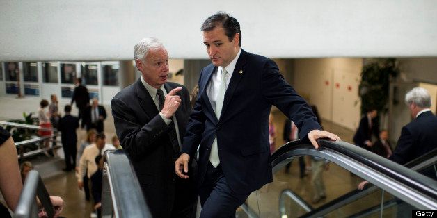 UNITED STATES - JUNE 27: Sen. Ron Johnson, R-Wisc., left, and Sen. Ted Cruz, R-Texas, talk as they head to the Senate floor as the Senate considers its immigration reform bill on Thursday, June 27, 2013. (Photo By Bill Clark/CQ Roll Call)