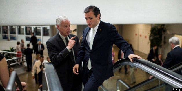 UNITED STATES - JUNE 27: Sen. Ron Johnson, R-Wisc., left, and Sen. Ted Cruz, R-Texas, talk as they head to the Senate floor a