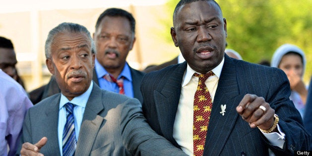 SANFORD, FL- MARCH 26: (L-R) Rev. Al Sharpton, Jessie Jackson, and Benjamin Crump, attorney for the Trayvon Martin family, join together in a protest march just prior to a town hall meeting, March 26, 2012 in Sanford, Florida. The teenager's family addressed the town hall meeting along with Rev. Al Sharpton. Martin was killed by George Michael Zimmerman while on neighborhood watch patrol in the city. (Photo by Roberto Gonzalez/Getty Images)