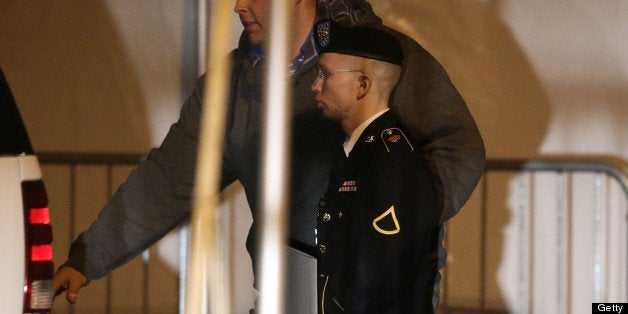 FORT MEADE, MD - FEBRUARY 28: Pfc. Bradley E. Manning is escorted from a hearing, on February 28, 2013 in Fort Meade, Maryland. Manning attended a motion hearing in the case of United States vs. Pfc. Bradley E. Manning, and is charged with aiding the enemy and wrongfully causing intelligence to be published on the internet. He is accused of sending hundreds of thousands of classified Iraq and Afghanistan war logs and more than 250,000 diplomatic cables to the website WikiLeaks while he was working as an intelligence analyst in Baghdad in 2009 and 2010. (Photo by Mark Wilson/Getty Images)