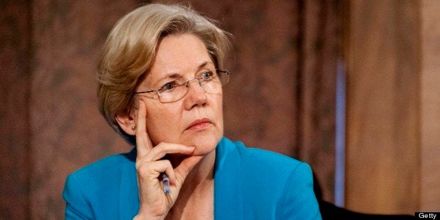 Senator Elizabeth Warren, a Democrat from Massachusetts, listens as Ben S. Bernanke, chairman of the U.S. Federal Reserve, not seen, answers a question during his semi-annual monetary policy report to the Senate Banking, Housing and Urban Affairs Committee during a hearing on Capitol Hill, in Washington, D.C., U.S., on Thursday, July 18, 2013. Bernanke said one reason for the recent rise in long-term interest rates is the unwinding of leveraged and 'excessively risky' investing. Photographer: Pete Marovich/Bloomberg via Getty Images