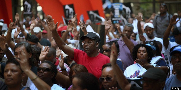 CHICAGO, IL - JULY 20: Demonstrators attend a 'Justice For Trayvon' rally at Federal Plaza in the Loop July 20, 2013 in Chicago, Illinois. The rally was one of a scheduled 100 to be held in cities across the country today to protest a Florida jury's decision last week to find neighborhood watch volunteer George Zimmerman not guilty of murder in the February 2012 shooting death of Trayvon Martin. (Photo by Scott Olson/Getty Images)