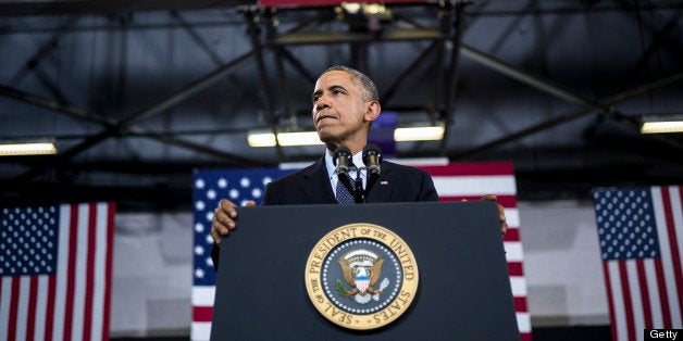 US President Barack Obama pauses while speaking at Knox College July 24, 2013 in Galesburg, Illinois. Obama is traveling to Illinois and Missouri to speak about the economy. AFP PHOTO/Brendan SMIALOWSKI (Photo credit should read BRENDAN SMIALOWSKI/AFP/Getty Images)