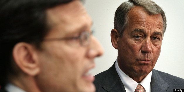 WASHINGTON, DC - MAY 15: U.S. Speaker of the House Rep. John Boehner (R-OH) (R) listens as House Majority Leader Rep. Eric Cantor (R-VA) speaks during a news conference after a closed House Republican Conference meeting May 15, 2013 on Capitol Hill in Washington, DC. Boehner spoke on various topics, including reports that the Internal Revenue Service targeted Tea Party groups for additional scrutiny. (Photo by Alex Wong/Getty Images)