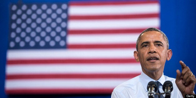 US President Barack Obama speaks at University of Central Missouri July 24, 2013 in Missouri. Obama traveled to Illinois and Missouri to speak about the economy. AFP PHOTO/Brendan SMIALOWSKI (Photo credit should read BRENDAN SMIALOWSKI/AFP/Getty Images)