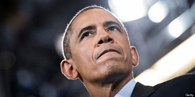 US President Barack Obama pauses while speaking at Knox College July 24, 2013 in Galesburg, Illinois. Obama is traveling to Illinois and Missouri to speak about the economy. AFP PHOTO/Brendan SMIALOWSKI (Photo credit should read BRENDAN SMIALOWSKI/AFP/Getty Images)