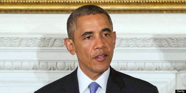 US President Barack Obama speaks during an Iftar dinner celebrating Ramadan in the State Dining Room of the White House in Washington, on July 25, 2013. AFP PHOTO / Saul LOEB (Photo credit should read SAUL LOEB/AFP/Getty Images)