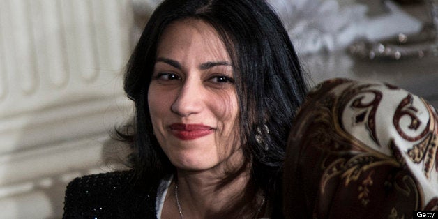 Huma Abedin (R), aide to US Secretary of State Hillary Clinton, and others listen while US President Barack Obama speaks in the State Dining Room of the White House on August 10, 2012 in Washington during Iftar, the fast-breaking meal of the Muslim holy month of Ramadan. AFP PHOTO/Brendan SMIALOWSKI (Photo credit should read BRENDAN SMIALOWSKI/AFP/GettyImages)