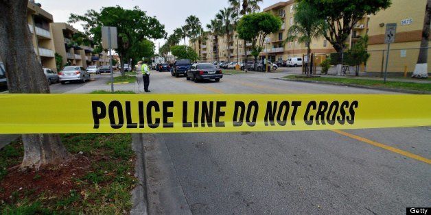 Police tape blocks the street to an apartment building after a shooting incident which began Friday evening left seven people dead in Hialeah, Florida, July 27, 2013. (Gaston De Cardenas/Miami Herald/MCT via Getty Images)