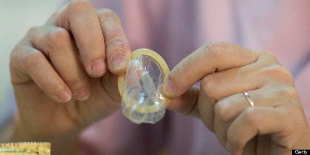 KON TUM, VIETNAM - 2013/03/11: Doctor Nguyen Thi Dieu Anh, 43 counsels a patient about pregnancy, using condoms and family pl