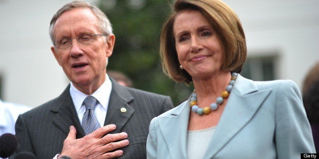 Senate Majority Leader Harry Reid, D-NV, speaks to reporters as House Speaker Nancy Pelosi, D-CA, looks on in front of the We
