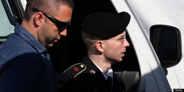 FORT MEADE, MD - JULY 30: U.S. Army Private First Class Bradley Manning (R) is escorted by military police as arrives to hear the verdict in his military trial July 30, 2013 at Fort George G. Meade, Maryland. Manning, who is charged with aiding the enemy and wrongfully causing intelligence to be published on the internet, is accused of sending hundreds of thousands of classified Iraq and Afghanistan war logs and more than 250,000 diplomatic cables to the website WikiLeaks while he was working as an intelligence analyst in Baghdad in 2009 and 2010. (Photo by Mark Wilson/Getty Images)