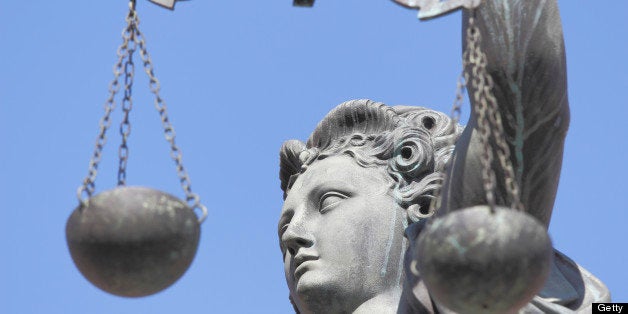 300 year old statue of Lady Justice overseeing the Well of Justice at Frankfurts Roemer Square / Germany