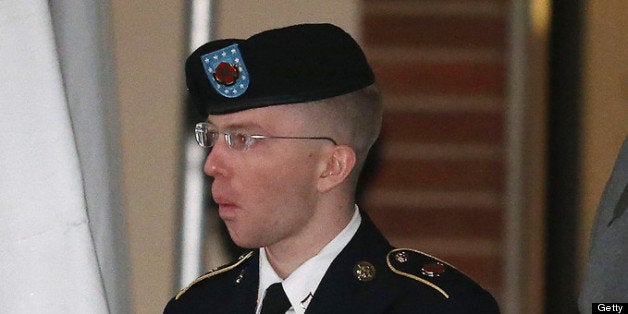 WASHINGTON, DC - JANUARY 08: Pfc. Bradley E. Manning is escorted from a hearing, on January 8, 2013 in Fort Meade, Maryland. Manning attended a motion hearing in the case of United States vs. Pfc. Bradley E. Manning, who is charged with aiding the enemy and wrongfully causing intelligence to be published on the internet. He is accused of sending hundreds of thousands of classified Iraq and Afghanistan war logs and more than 250,000 diplomatic cables to the website WikiLeaks while he was working as an intelligence analyst in Baghdad in 2009 and 2010. (Photo by Mark Wilson/Getty Images)