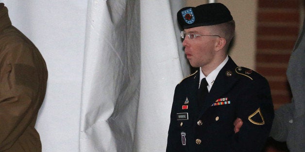 WASHINGTON, DC - JANUARY 08: Pfc. Bradley E. Manning is escorted from a hearing, on January 8, 2013 in Fort Meade, Maryland.